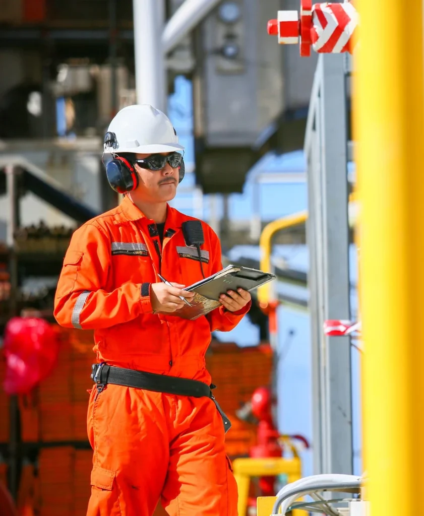 Andon technician inspecting a grab sampling system at a plant